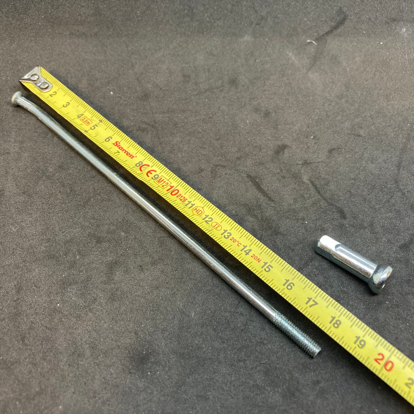 Spoke with nipple for 19" rim with small hub, used