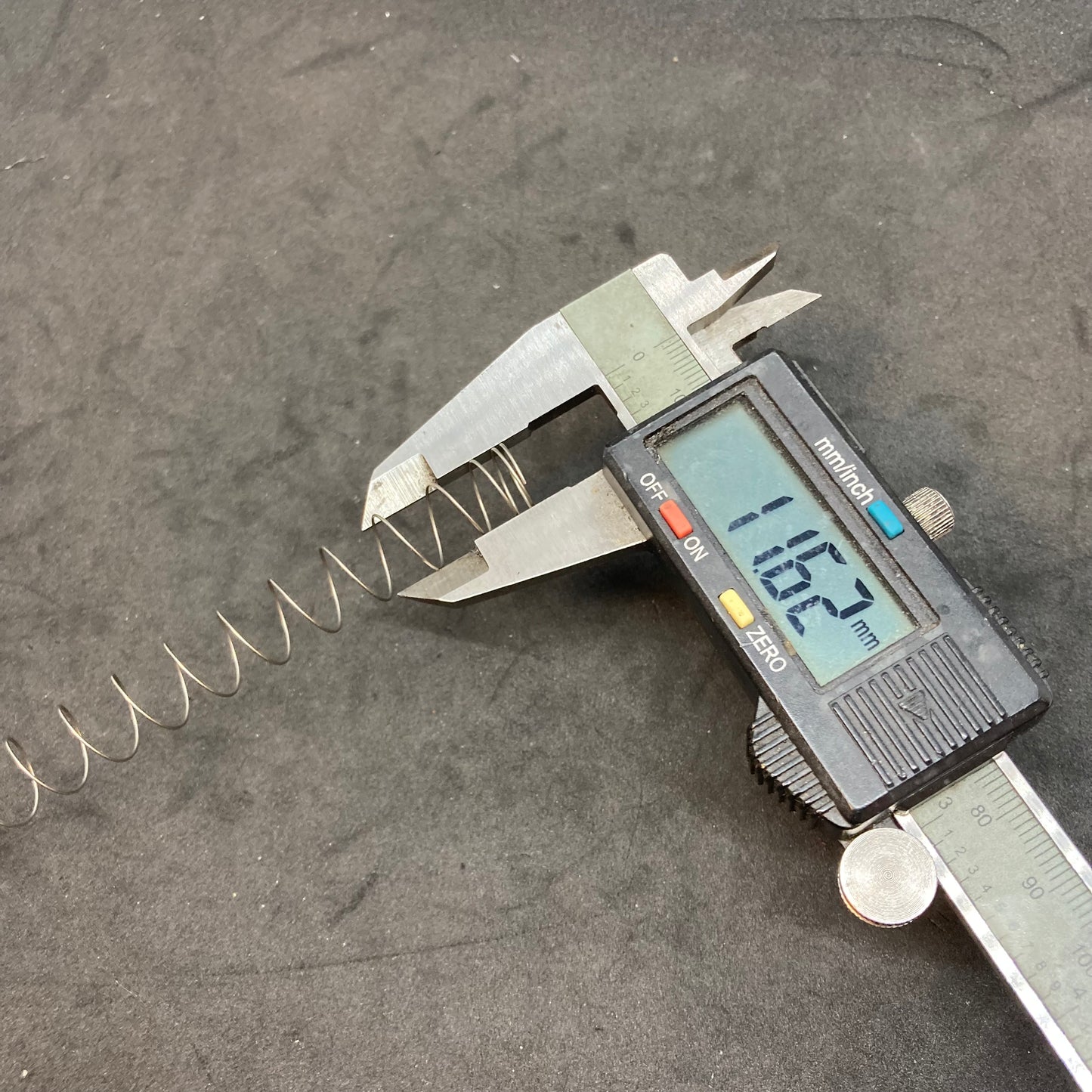 Vacuum piston return spring