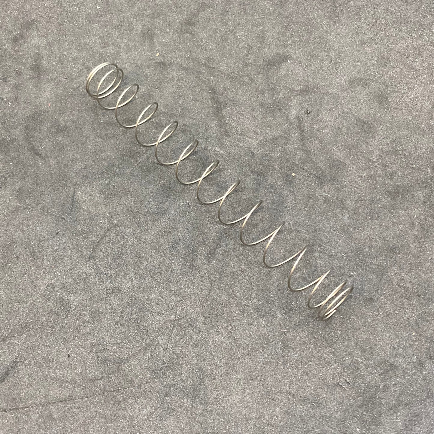 Vacuum piston return spring