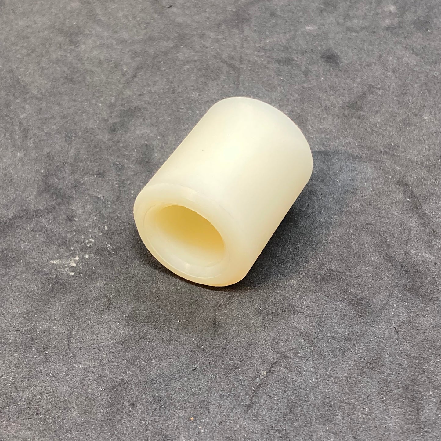 Rear brake reaction arm bushing