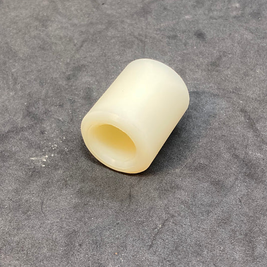 Rear brake reaction arm bushing