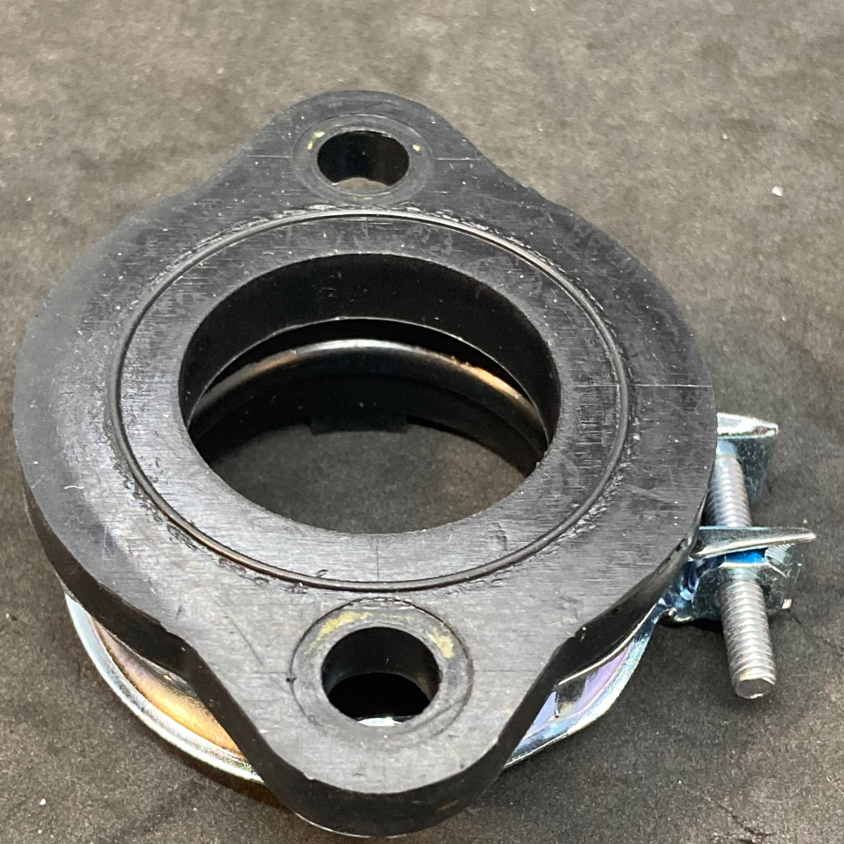 Alternative compliance flange through 2013 (carb holder)