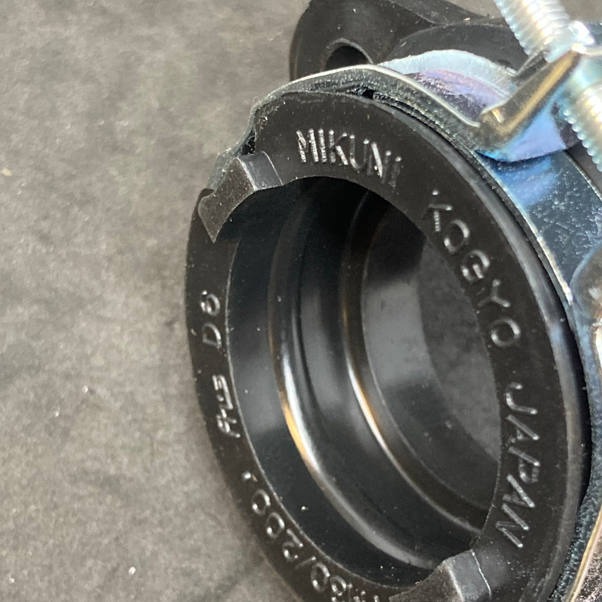 Alternative compliance flange through 2013 (carb holder)