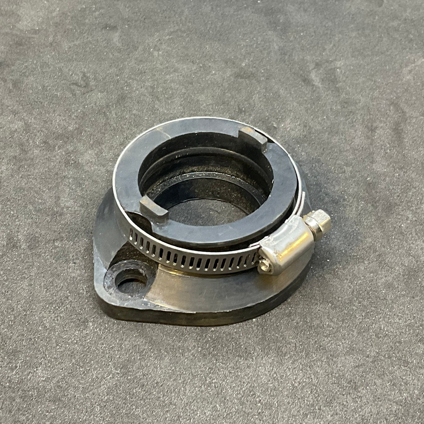 Alternative compliance flange through 2013 (carb holder)