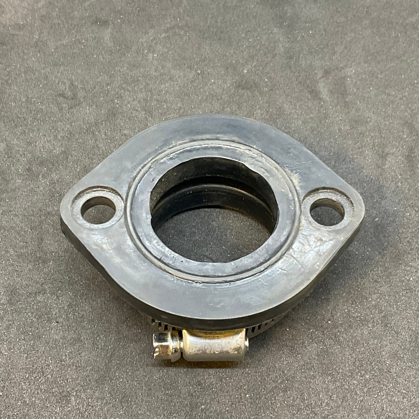 Alternative compliance flange through 2013 (carb holder)